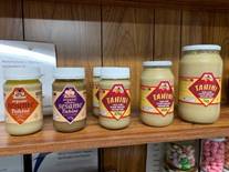 A shelf with jars of food on it

AI-generated content may be incorrect.